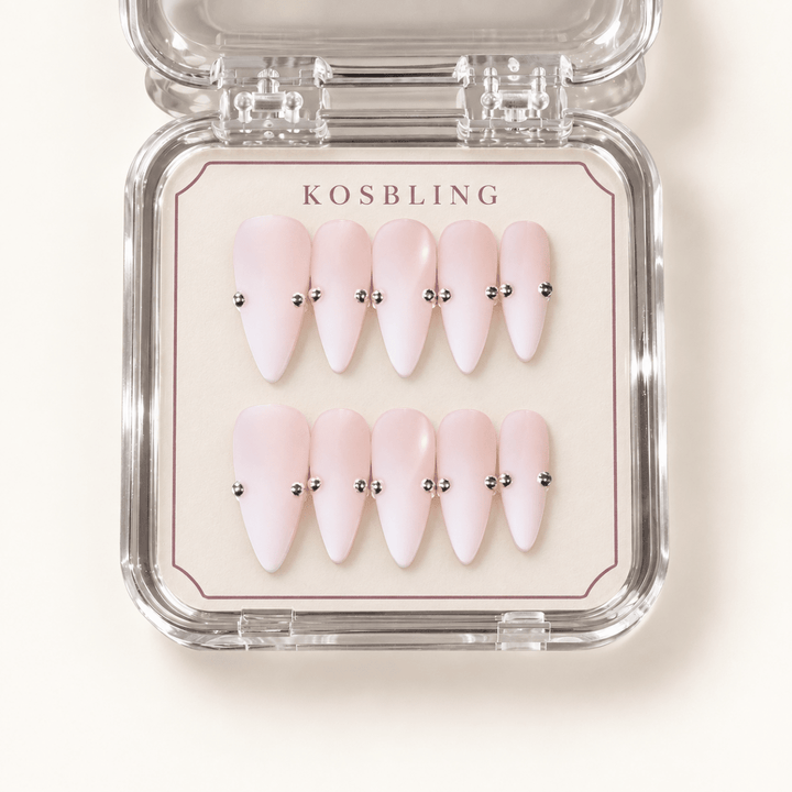 Stone handmade press-on nails with dimensional details in KOSBLING packaging
